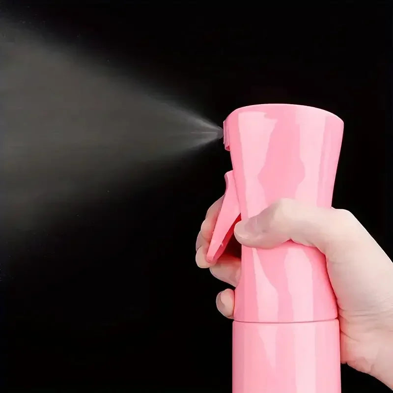Continuous mist spray bottle for refreshing curls and hydrating natural hair.